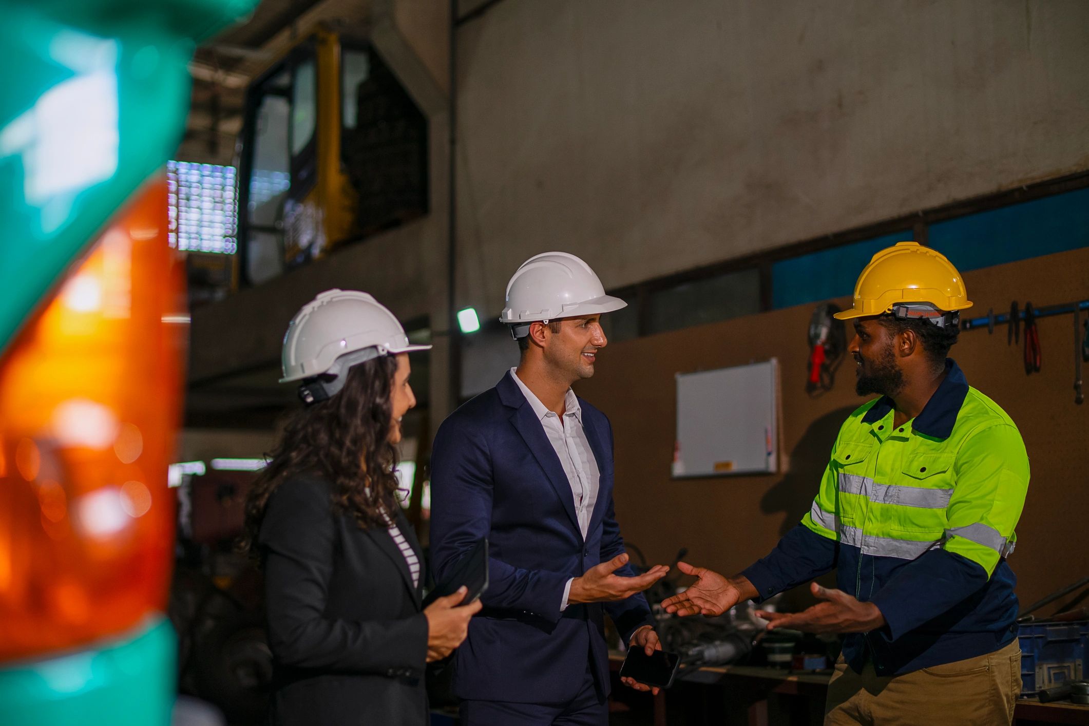 Engineer meeting with business professional at construction site