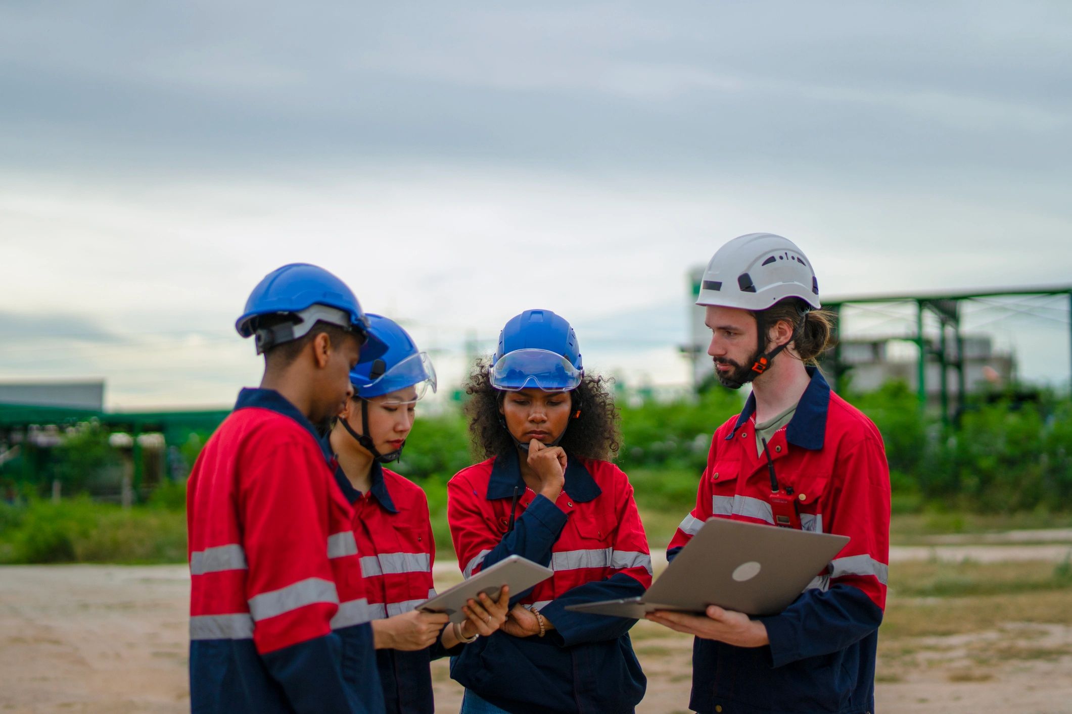 Industrial site workers collaborating