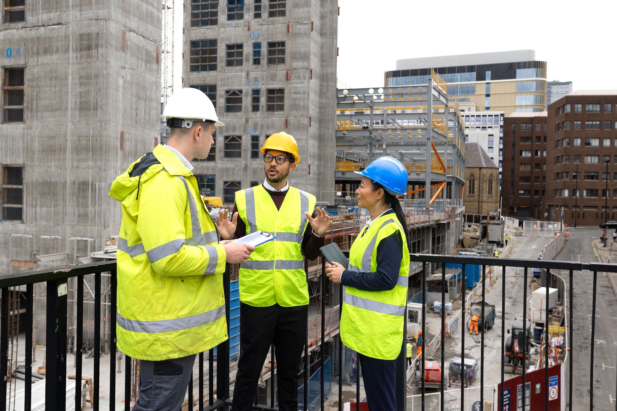 Construction team discussing plans on site