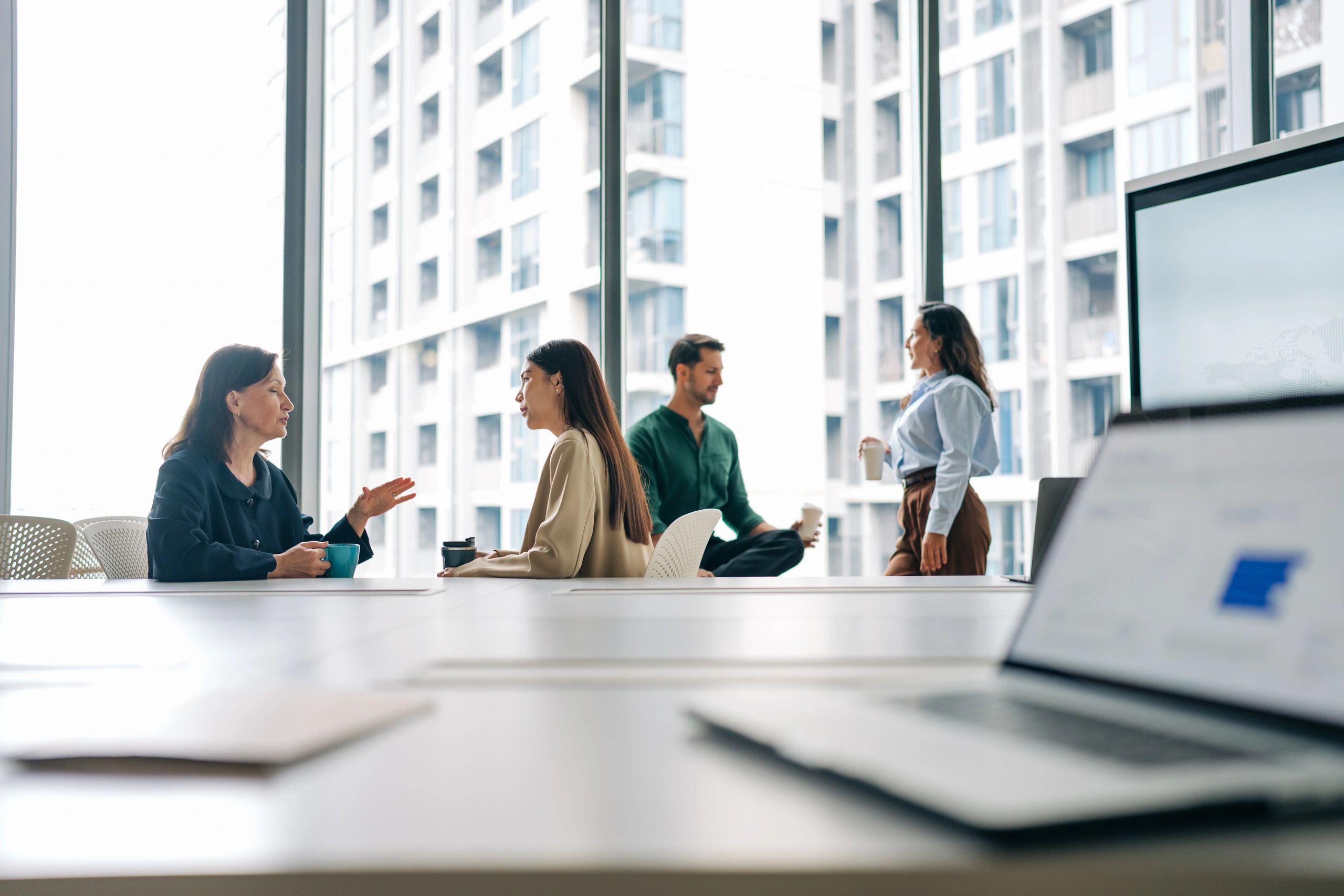 Business colleagues chatting in conference room